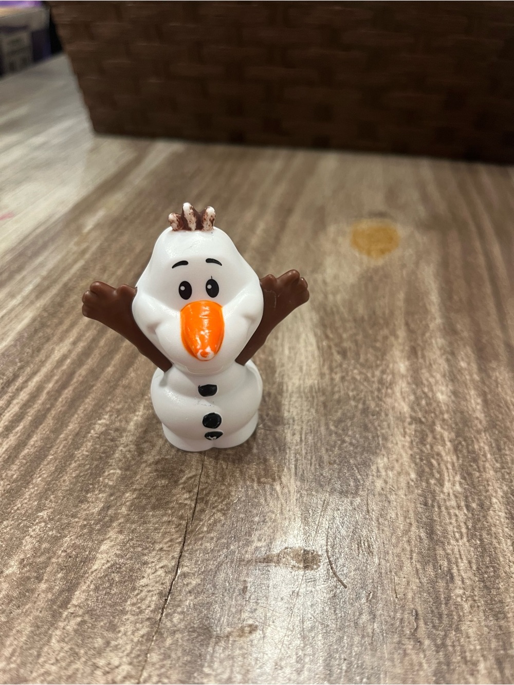 White Snowman Action Figure Toy with Orange Nose and Brown Arms